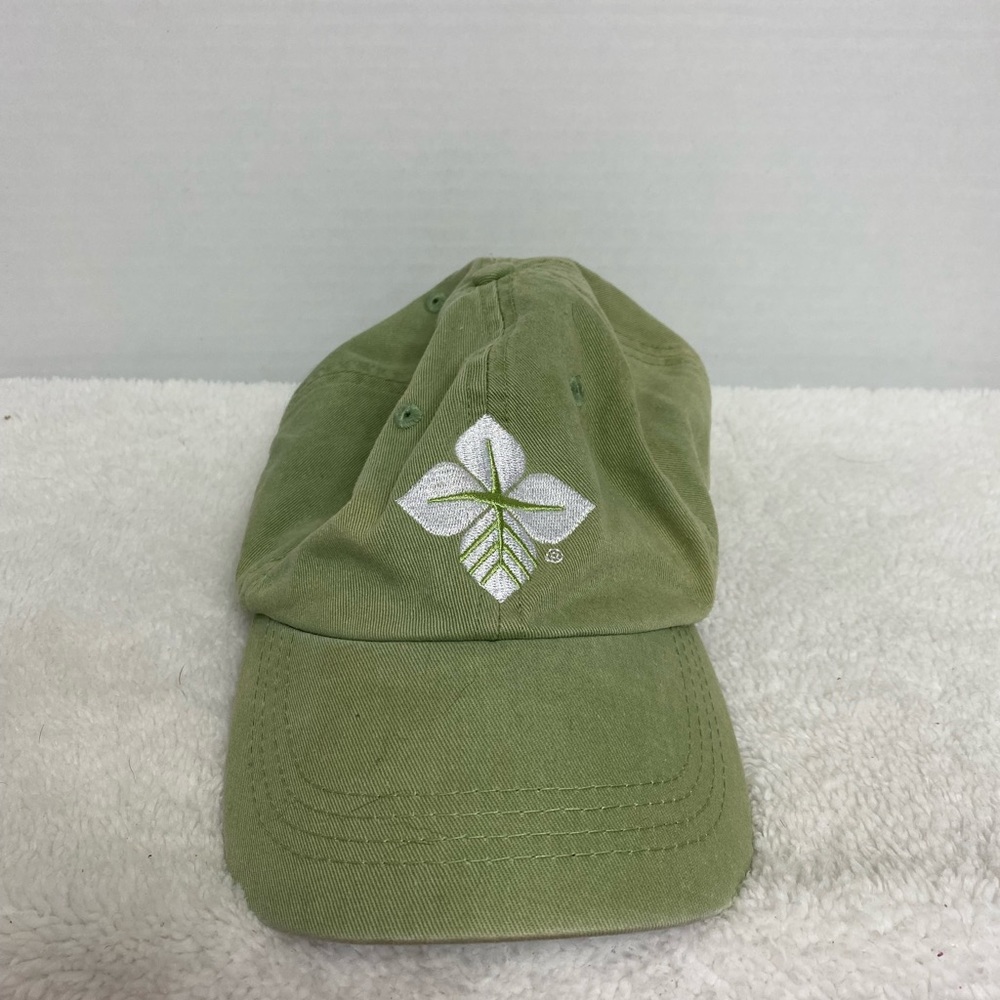 Alternative Women’s green hat with white flower.